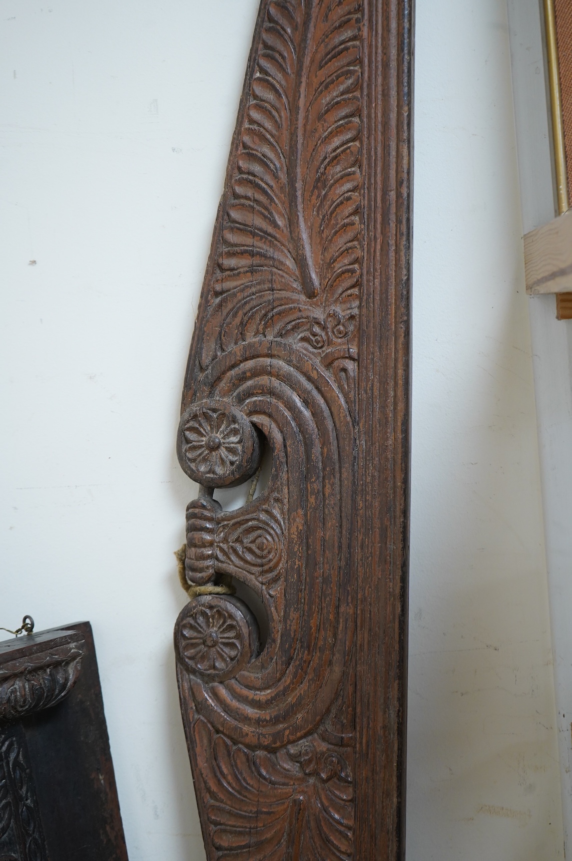An Anglo-Indian carved wood crest and a similar door portico, latter 127cm in length